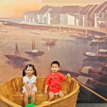 Kids taking photos in our SG Bicentennial inspired photobooth.